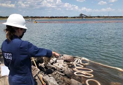 A Coast Guard pollution responder observes the Port of Corpus Christi Ship Channel for possible pollution impacts after the dredging vessel Waymon L Boyd sank in Corpus Chrisiti, Texas. (U.S. Coast Guard photo)