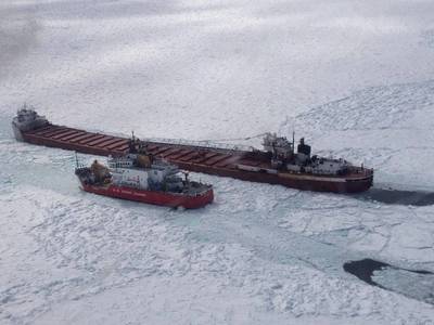 The crew of Coast Guard Cutter Mackinaw, homeported in Cheboygan, Mich., conducts an escort on Lake Superior near Whitefish Point April 3, 2014. (USCG photo)