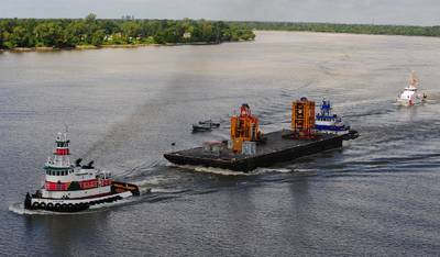 Coast Guard, New Orleans Port Authority and Homeland Security units provide an escort as the blowout preventer of the Deepwater Horizon is transported on the Mississippi River into New Orleans, Sept. 11, 2010. The blowout preventer will be used to help the joint BOEM/USCG investigation determine the circumstances surrounding the explosion, fire, pollution, and sinking of the Mobile Offshore Drilling Unit Deepwater Horizon. U.S. Coast Guard photo by Petty Officer 3rd Class Stephen Lehmann