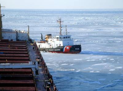 The crew of Coast Guard Cutter Neah Bay, homeported in Cleveland, works to keep the CSL Laurentien moving during an escort in eastern Lake Erie March 27, 2014. (U.S. Coast Guard photo courtesy of CSL Laurentien)