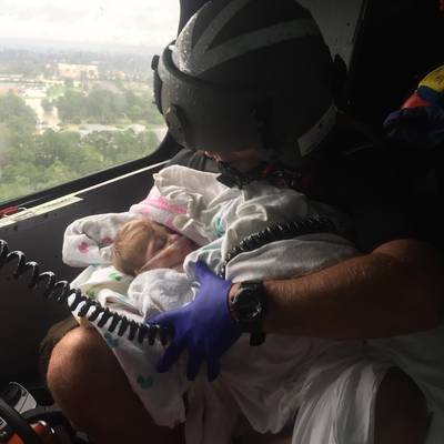 Coast Guard Aircrew Assists Infant During the Aftermath of Hurricane Harvey (U.S. Coast Guard photo by Chase Redditt)