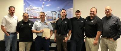 COI presentation at WMI’s Cranford, N.J. office, from L to R: Patrick Whelan, Executive VP and General Counsel; Ronnie Clifford, Towing Compliance Office; Cmdr. Jacob Hobson, USCG; Shaun O’Brian, Towing Sr. Port Engineer; Jason Marchioni, VP of Marine Services; Capt. Benjamin Peterson, Towing Manager; and Eric Ellefsen, President. (Photo: WMI)