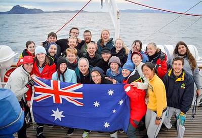 Commanding Officer of STS Young Endeavour, Lieutenant Commander Gavin Dawe OAM RAN (front, centre), and World Voyage Passage One Youth Crew celebrate rounding Cape Horn on Australia Day 2015.