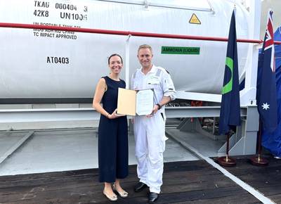 Cristina Saenz de Santa Maria, DNV’s Regional Manager South East Asia, Pacific & India, Maritime, handed over class and statutory certificates to Dino Otranto, Fortescue Metals CEO, for the dual-fueled ammonia-powered vessel Green Pioneer (Photo: DNV)