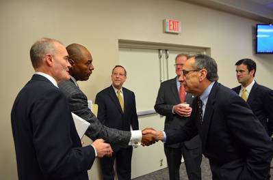 Crowley's Bill Pennella (right), Vice COB/EVP, and JAXPORT's Dr. John Allen Newman (left), Board Vice Chair, agree to the expanded, long-term lease at JAXPORT’s Talleyrand Marine Terminal.