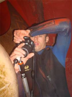 Factory Trained diver / technician inspecting potential damage to the pitch control system on the tunnel thruster