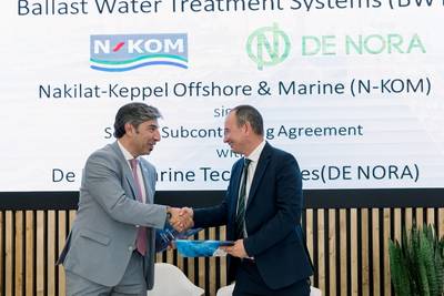 Dimitrios Tsoulos, Regional Sales Manager EMEA, De Nora Marine Technologies, (R) is joined by Georgios Moutzourogeorgos, Chief Commercial & Business Development Officer, NKOM, during the formal signing of the service subcontracting agreement with Nakilat-Keppel Offshore & Marine (N-KOM), to expand service convenience for De Nora Ballast Water Management Systems (BWMS) installed on vessels trading in the Gulf region. Image courtesy De Nora
