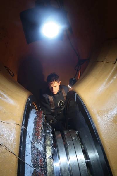 Hydrex diver/technician working inside flexible mobdock. Photo courtesy Hydrex