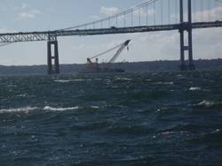 Donjon’s Chesapeake 1,000 heavy lift crane works to salvage a sunken barge under the Newport Pell Bridge in Newport, Rhode Island last November.