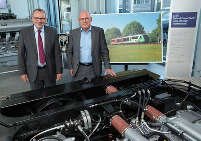Dr Ulrich Dohle (left), CEO of Rolls-Royce Power Systems, talks to Winfried Hermann, Minister of Transport in Baden-Württemberg, about eco-friendly drive concepts for rail transport.  (Photo: Rolls-Royce)