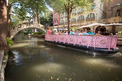 Each of the Lake Assault river barges on the San Antonio River Walk can be configured and modified in a range of floor plans to support touring, dining, commuting, entertaining, and other applications.  (Lake Assault Boats)