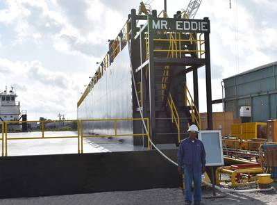 Eddie Barnes, Jr., namesake for new dry-dock at Bollinger Quick Repair, Harvey, La. stands in front of the “Mr. Eddie”. (Photo: Bollinger Shipyards)