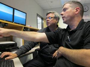 Eric Larsson and Stephen Polk working together at SCI's Center for Maritime Education in Houston, TX. Photo courtesy SCI