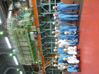 FAT attendees pictured in front of the ME-GI engine at MES’s Tamano Works (Photo: MAN Diesel & Turbo)