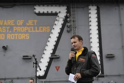 File photo: Capt. Brett Crozier, commanding officer of the aircraft carrier USS Theodore Roosevelt (CVN 71), addresses the crew during an all-hands call on the ship’s flight deck in November 2019 (U.S. Navy photo by Nicholas Huynh)