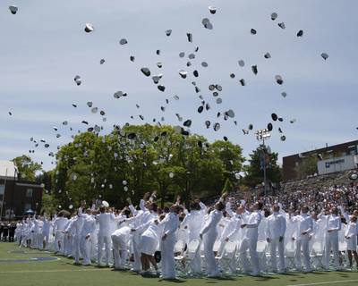 File photo: The cadets of the class of 2019 throws their covers into the air as they officially become ensigns during the 138th commencement exercises at the U.S. Coast Guard Academy in New London, Conn., May 22, 2019. (U.S. Coast Guard photo by Matthew Thieme)