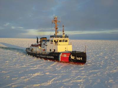 File photo: The US Coast Guard Cutter Katmai Bay, a 140-foot ice-breaking tug, escorts a motor vessel  through Lake Michigan near Lansing Shoal, in 2014. The cutter was operating as part of Operation Taconite, which is the icebreaking operation for the northern Great Lakes. (U.S. Coast Guard photo by Daniel R. Michelson)