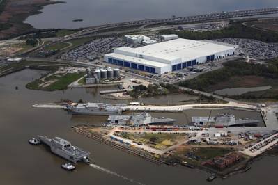 File photo: USS Tulsa (LCS 16) is heading back to Austal USA after launching from the drydock at BAE Ship Systems in March 2016. She's passing Austal's vessel completion yard where USNS Yuma (EPF 8), USS Gabrielle Giffords (LCS 10) and future USS Omaha (LCS 12) are docked. (Photo: Austal USA)