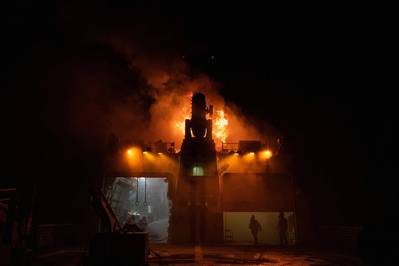 Firefighting teams combat flames on board the Coast Guard cutter Waesche in the Western Pacific Ocean. (Coast Guard photo by Aidan Cooney)

