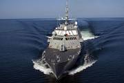 The first U.S. Navy Littoral Combat Ship, Freedom (LCS 1), the inaugural ship in an entirely new class of U.S. Navy surface warships, is seen conducting a speed run during Builders Trials. The ship is designed for littoral, or close-to-shore, operations and to provide access and dominance in coastal-water areas. Photo provided courtesy Lockheed Martin
