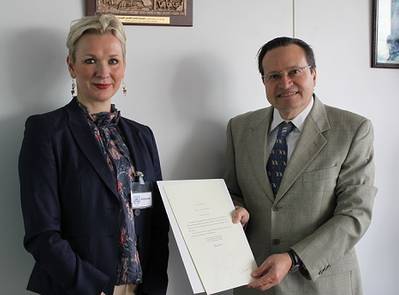 First Secretary Kristin Stockman of the Royal Norwegian Embassy to the United Kingdom, hands over Norway’s instrument of accession to the  Hong Kong International Convention for the Safe and Environmentally Sound Recycling of Ships, 2009, to Mr. Gaetano Librando, Head, Legal  Affairs Office, Senior Deputy Director, Legal Affairs and External Relations Division, IMO