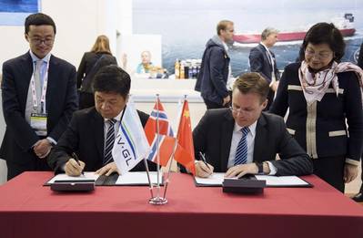 Front, from left to right: Gui Ming Zhu, Deputy General Manager of CMIH and Director of Yiu Lian Dockyards (Shekou) Limited; and Torgeir Sterri, Regional Manager Greater China at DNV GL – Maritime; sign a strategic cooperation agreement at Nor-Shipping this week. (Photo: DNV GL)
