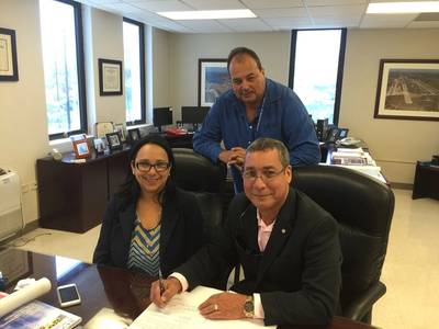 Front: Ingrid Colberg, Executive Director, Puerto Rico Ports Authority, and Jose Francisco Nazario, director, finance, Crowley. Back: Edwin Rodriguez, Chief of Maritime Bureau (Photo: Crowley)