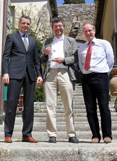 FutureShip's Stefan Deucker (left) and Volker Bertram (right), who organises the COMPIT, present the COMPIT Award to Herbert Koelman, SARC.