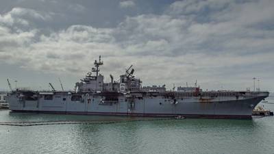 The fire-stricken amphibious assault ship USS Bonhomme Richard (LHD 6) sits pier side at Naval Base San Diego in July 2020. (Photo: Jason Waite / U.S. Navy)