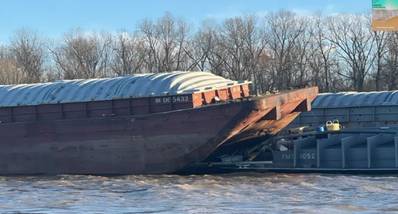 Hopper barge IN065432 (left) from the Carol McManus tow, and tank barge
FMT1052 (right) from the Big D tow, post-casualty. (Source: Ingram Barge Company, courtesy NTSB)