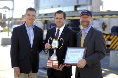 Christopher Grundler, left, director, office of transportation and air quality for the U.S. Environmental Protection Agency and Stan Meiburg, right, acting regional administrator for the EPA’s Southeast Region, present Georgia Ports Authority Executive Director Curtis Foltz, center, an award for environmental stewardship at the GPA Garden City Terminal. (GPA Photo/Stephen Morton)