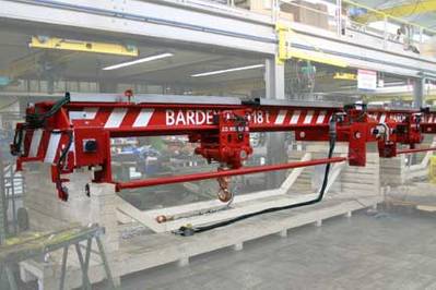 A hydraulically operated overhead crane with a hoist lift capacity of 18 tons, manufactured by J D Neuhaus for Bardex Corporation