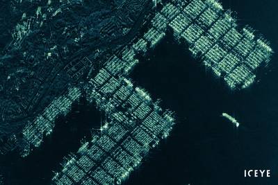 ICEYE radar satellite image from the Pasir Panjang container terminal of Singapore, taken on December 20, 2019. Image shows the container ports, several anchored cargo vessels, and a vessel maneuvering alongside the port. (Image: ICEYE)