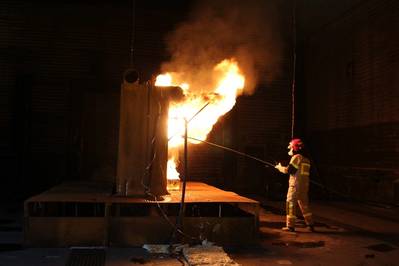 Ignition of pool fire in a test of a water mist system according to IMO 1165. Photo: Kristian Hox, SINTEF NBL.    