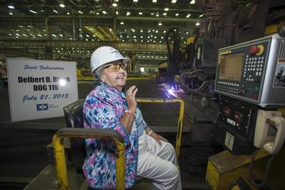 Ima Black reacts after starting a plasma cutter machine at Ingalls Shipbuilding, officially beginning construction of the Arleigh Burke-class destroyer Delbert D. Black (DDG 119), which is named in honor of her late husband. (Photo by Andrew Young/HII)