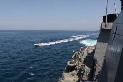 Iranian Islamic Revolutionary Guard Corps Navy (IRGCN) vessels approach U.S. Military ships in international waters of the North Arabian Gulf. (U.S. Navy photo)