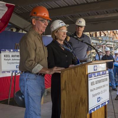 With Ingalls Shipbuilding President Brian Cuccias (right) observing, shipfitter Bob Boegner (left) and Ship Sponsor Georgeann McRaven delcare the keel of Ralph Johnson (DDG 114) to be “truly and fairly laid.” Photo by Lance Davis/HII