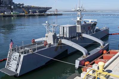 The medium-displacement unmanned surface vessel Sea Hunter sits pierside at Naval Base San Diego, during the Unmanned Surface Vessel Division (USDIV) One Establishment ceremony. USDIV One will focus on unmanned surface vessel experimentation and fleet advocacy for the surface force. (Photo: Kevin C. Leitner / U.S. Navy)