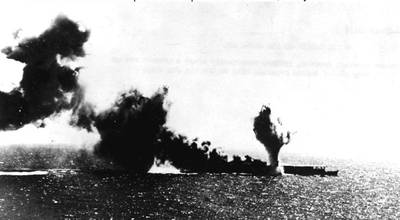 Japanese aircraft carrier Shoho is torpedoed, during attacks by U.S. Navy carrier aircraft in the late morning of 7 May 1942. Photographed from a USS Lexington (CV-2) plane. (Official U.S. Navy Photograph, National Archives.)