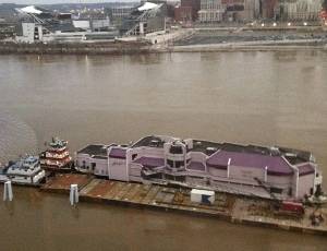 Jeff Ruby’s Waterfront restaurant and barge being pushed back upriver by C&B Marine towboats. Photo courtesy C&B Marine.