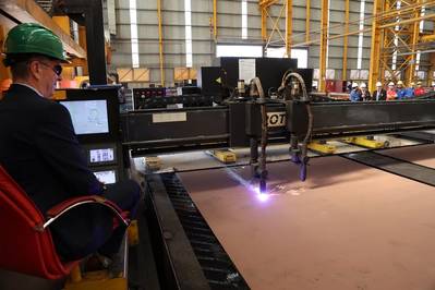 Jim Anderson, director of vessels at CMAL, starts up the machine to cut the first piece of steel. (Photo: CMAL)