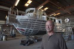 Kerry Neuville with the RORCO crew boat at his New Iberia yard. 