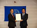 Koichi Fujiwara, Executive Vice President of ClassNK presented the official certificates to Masami Sasaki, Managing Executive Officer of Kawasaki Kisen Kaisha, Ltd.