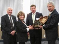 Kris Carroll Receives the Award: Photo credit Center for Coastal Conservation