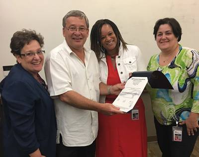 (L to R): Sharon Baris, director, contract administration; Mike Golonka, vice president, government services; Maria Hope, manager, technology and Lisa Leone, business systems analyst (Photo: Crowley)