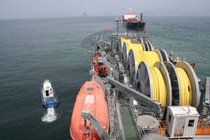 Military Sealift Command offshore petroleum distribution system ship MV Vice Adm. K.R. Wheeler (foreground) and MSC tanker USNS Lawrence H. Gianella (background) practice running a float hose between them during a one-day exercise off the coast of Yeosu, South Korea, Aug. 18. Wheeler is a one-of-a-kind ship that receives fuel from a commercial or military tanker and then pumps that fuel to warfighters ashore using eight miles of flexible pipe that is carried aboard the ship's weatherdeck.  (U.S.