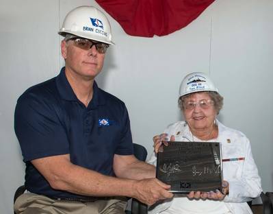 Ingalls Shipbuilding President Brian Cuccias presents a ceremonial keel plate to Ima Black, the sponsor of her husband’s namesake ship, Delbert D. Black (DDG 119). (Photo by Andrew Young/HII)