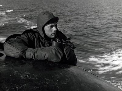 Lookout on the bridge of USS Nautilus (SSN 571) keeps an alert watch for pieces of ice as the Nautilus presses closer to the Polar Ice Cap, August 1958. (NHHC Photograph Collection, L-File, Ships)