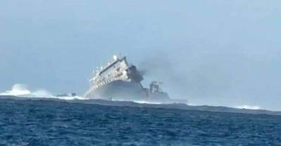 Manawanui listing on the reef, October 6. (Photo: Samoa Fire and Emergency Services Authority)
