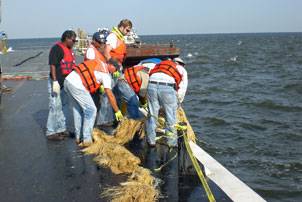 Mariners participate in an oil spill response drill. Photo courtesy Eric Helpenstell. Photo courtesy Eric Helpenstell.